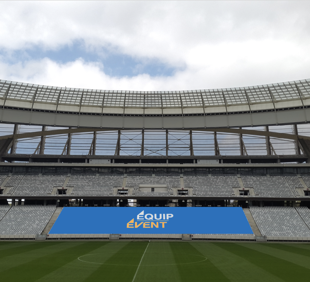Stadium grandstand covered with a customised blue cover bearing the Equip Event logo