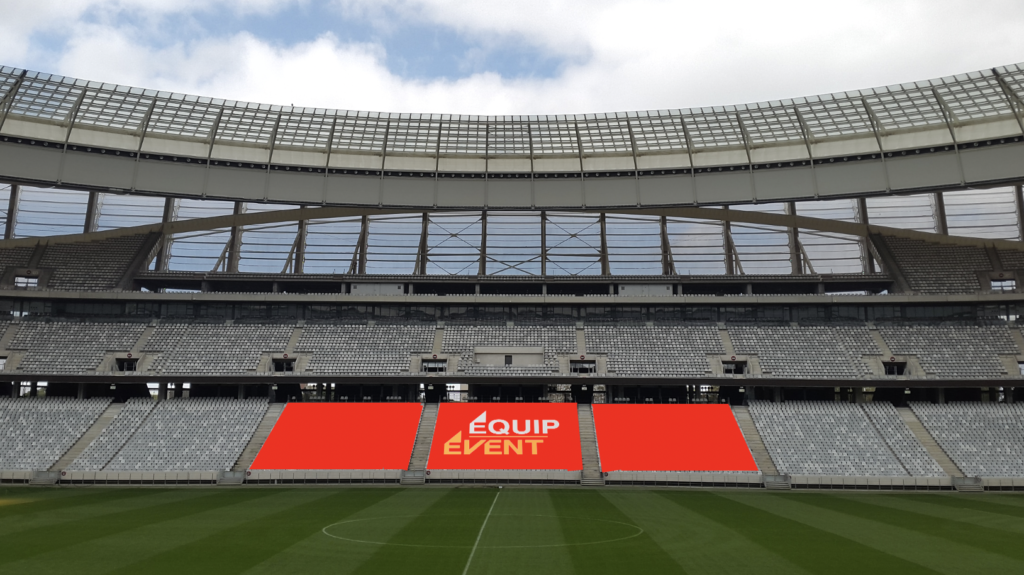 Stadium grandstand covered with a customised red cover bearing the Equip Event logo