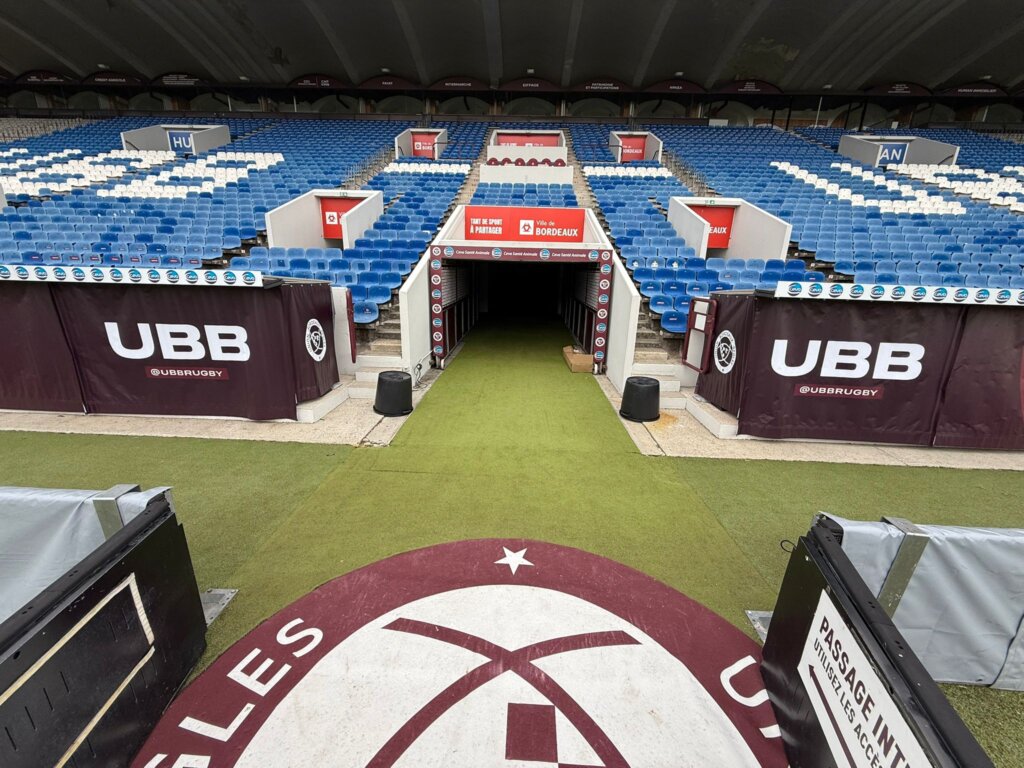 Dugouts dressed in printed UBB fabric on either side of the Union Bordeaux-Bègles players’ tunnel